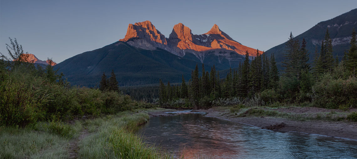 Three sisters mountains overlooking Bow River