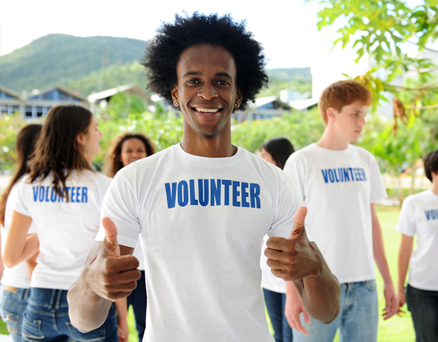 Volunteers outside in white t-shirts